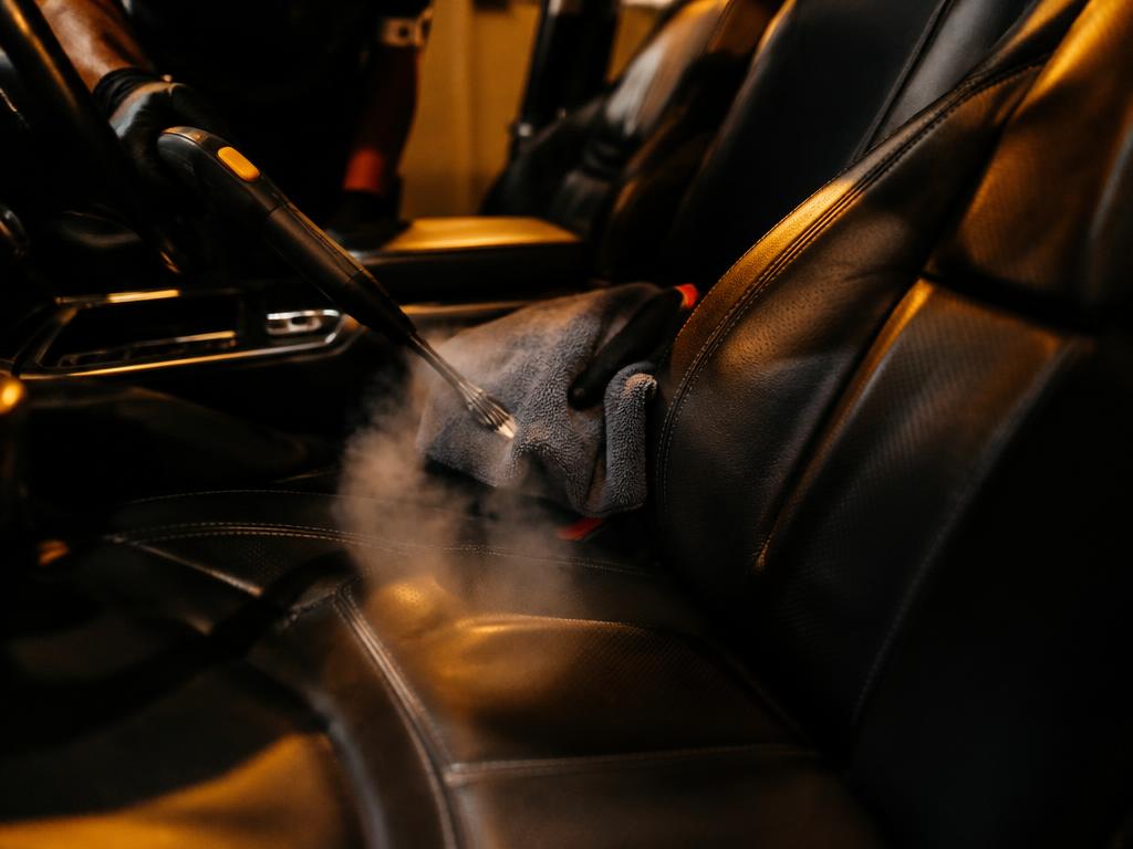 Steam cleaning a leather car interior